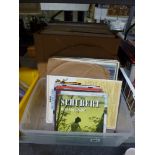 A collection of 12, 10 and 7 in records in two boxes, mainly classical and musicals, including