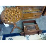 A Victorian pedestal table the top inlaid as a chess board, 32 chess men and a small set of wall