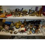 Two shelves of mixed items including Oriental figurines, carved wood elephant ornaments, sliced