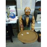 A floor-standing model of a waiter holding a tray. TO BID ON THIS LOT AND FOR VIEWING APPOINTMENTS