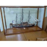 A large and impressive professionally built model of the 'Cutty Sark' in wooden and glazed case,