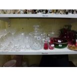 A shelf of glassware comprising a suite of Stuart Crystal glassware including nine hock glasses,