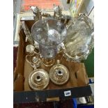 A carton of silver-plated items, including a pair of chamber candlesticks, ornate salver,
