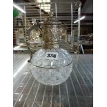 A late Victorian cut-glass claret jug, of squat form with profusely embossed mounts, monogrammed and