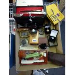A mixed lot in a carton to include a pair of Mirandd 10x50 binoculars, a boxed propelling pencil,