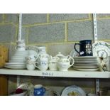 Three shelves of mixed china and glassware including a Boots 'Orchard' pattern part tea and dinner
