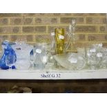 Two shelves of glassware including cut glass brandy balloons and whisky tumblers, vases, jugs,