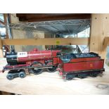 Trains: an '0' gauge clockwork Bassett Lowke locomotive and tender, LMS, Duke of York [shelves top