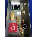 A Dunhill pipe with 9 ct gold band, a Dunhill cigar cutter, cigarette lighter, pipe reamer and