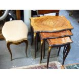 A nest of three tables each of shaped rectangular form with floral marquetry tops on cabriole legs