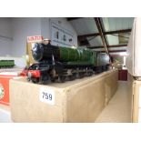 Trains: an '0' gauge electric model steam locomotive, County of Somerset with tender, in GWR green
