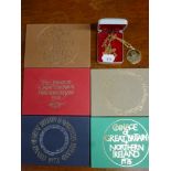 Five folders of mint coinage of Great Britain and Northern Ireland 1972-1975 and a commemorative