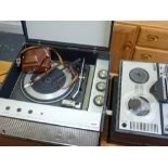 A Bush Transistorised record player in a black fabric cover, a Grundig reel-to-reel tape recorder