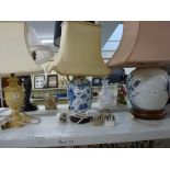 An Oriental ginger jar and cover and a blue and white vase both converted to lamps with shades