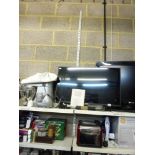 A Sony 30 in flat screen television on stand with remote control [G23] plus a computer table