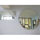 A circular wall mirror with bevelled glass and etched with laurel banches (71 cm diameter), and a
