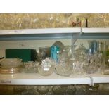 A shelf and a half of glassware including cut glass hock glasses, brandy balloons, cut glass wine