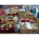 A large and impressive lot of costume jewellery in four cartons and a jewel box including many