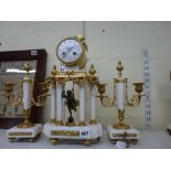 An elegant French clock garniture in Louis XVI style in white marble and ormolu, the portico clock