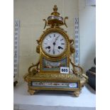 A good late 19th century French ormolu mantel clock in Louis XVI style, inset with Sevres-style