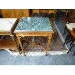 A charming occasional table of rectangular form with green marble top raised on fluted tapering legs