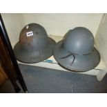 Two World War One tin helmets. [sZ] TO BID ON THIS LOT AND FOR VIEWING APPOINTMENTS CONTACT