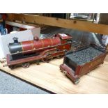 Trains: an '0' gauge clockwork locomotive and tender, LM&S, name plate George the Fifth [shelves top