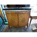 A handsome French Serpentine fronted cabinet beneath a marble, the frieze drawer fitted for