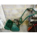 A Qualcast Petrol Lawnmower. [by G25] TO BID ON THIS LOT AND FOR VIEWING APPOINTMENTS CONTACT
