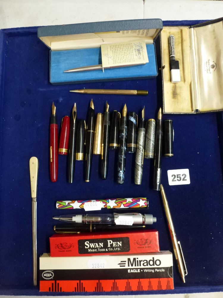 A good lot of fountain pens including four by Waterman, three with 14 ct gold nibs in black, red and