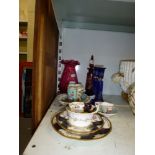 A Bohemian ruby-flashed engraved scent bottle with stopper, pair of blue overlay glass candlesticks,
