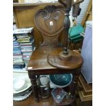 A handsome William IV mahogany shield back hall chair with moulded decoration raised on fluted