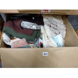 A small box of assorted table linen, oven gloves, etc. [upstairs wooden shelves] TO BID ON THIS