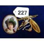 9 ct gold jewellery comprising: a gold-mounted German porcelain brooch painted with a young Tyrolean