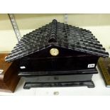 An unusual large cigar humidor, in the form of a black tiled house, 13 in high [C] WE DO NOT TAKE