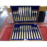 An Edwardian set of silver fish eaters for 12, with cream handles, Sheffield 1907, in oak case WE DO