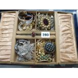 A jewel box containing antique and later costume jewellery, including paste and marcasite pieces,