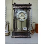 An impressive American Ansonia four-glass clock, the two-piece dial with visible escapement, gong-