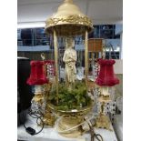 Three branch candlesticks with crystal drops, a large decorative figural light decorated with a