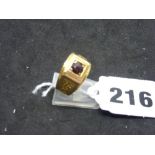 A man's ring in 9 ct gold set with a garnet, London 1976, 4.9 gm WE DO NOT TAKE CREDIT CARDS OR