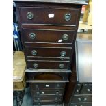 A reproduction lady's bureau the fall above four drawers and a pair of miniature chests each of four