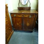 An 18th century mahogany cabinet with cantered corners, the top with a marquetry panel of flowers in