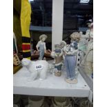 Six pieces of Lladro comprising a Polar bear, a Polar bear with Eskimos riding on his back, an