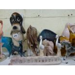 A quantity of animal figurines including a blue glazed bull, dogs, flamingos, two Wade rabbits, a