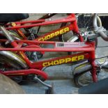 A vintage red Raleigh Chopper bike [back door] WE DO NOT TAKE CREDIT CARDS OR CASH. STORAGE IS