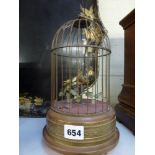 A mid-20th century singing bird musical automaton, in cage, with moving beak, head and tail, 12 in
