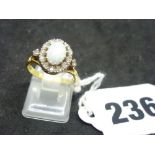 An 18 ct gold opal and diamond cluster ring, London 1968, 4.9 gm WE DO NOT TAKE CREDIT CARDS OR