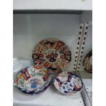 A collection of Japanese Imari porcelain, comprising six dishes and three bowls, together with an