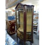 A Louis XIV-style serpentine vitrine the domed top above a shaped glass door and painted panel on