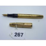An English Waterman fountain pen, with 14 ct nib, in reeded 9 ct gold casing, London hallmark for